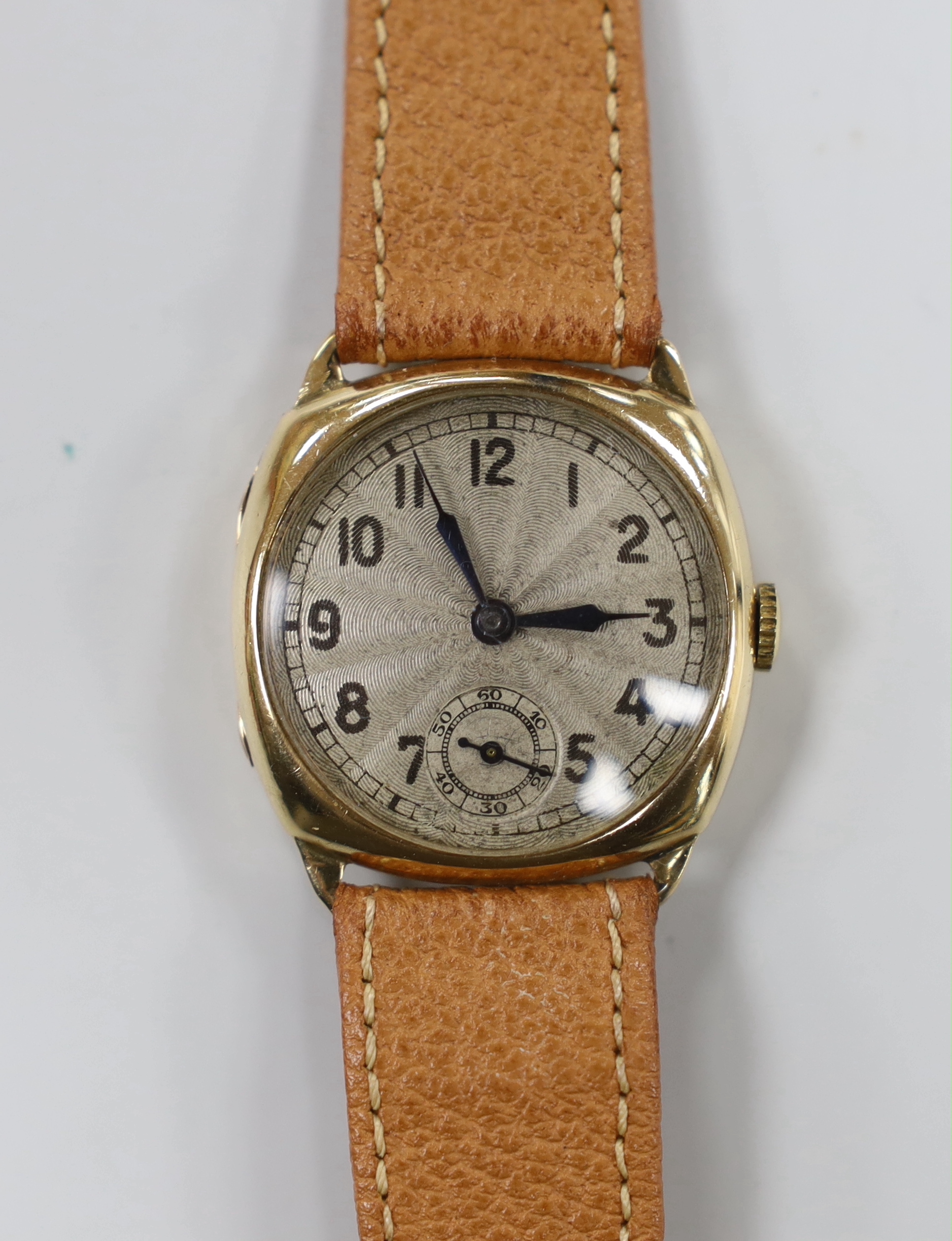 A gentleman's 1930's? 9ct manual wind wrist watch, with Arabic dial, on a leather strap.